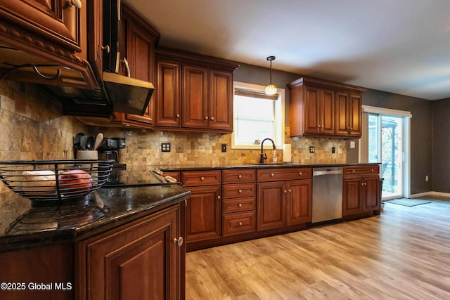 kitchen with dishwasher, backsplash, sink, dark stone countertops, and light hardwood / wood-style floors