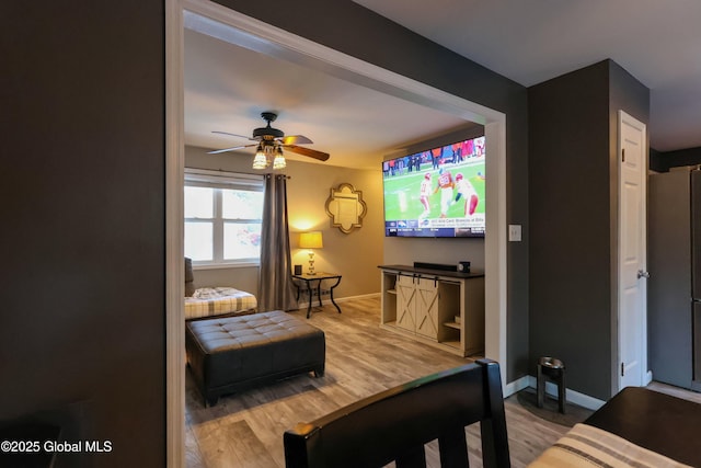 bedroom with ceiling fan and wood-type flooring