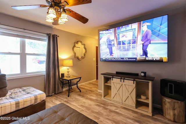 interior space with ceiling fan and wood-type flooring