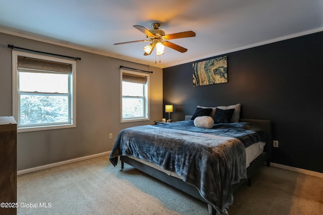 bedroom with carpet, ceiling fan, and ornamental molding