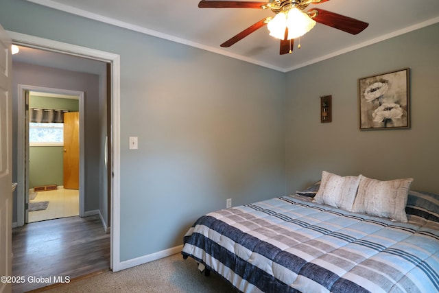 bedroom with ceiling fan and ornamental molding