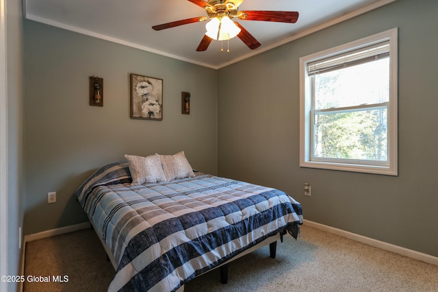 bedroom featuring carpet, ceiling fan, and crown molding