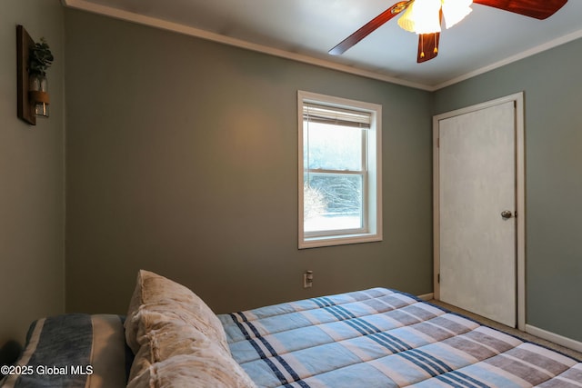 bedroom featuring ceiling fan and ornamental molding