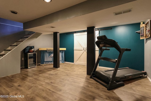 workout room featuring hardwood / wood-style flooring