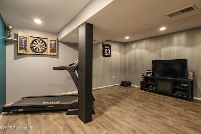 exercise area featuring wood-type flooring