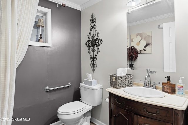 bathroom with vanity, toilet, and ornamental molding