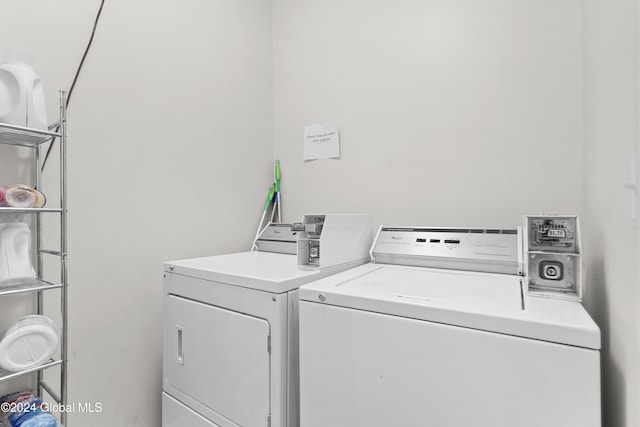 clothes washing area featuring washing machine and dryer