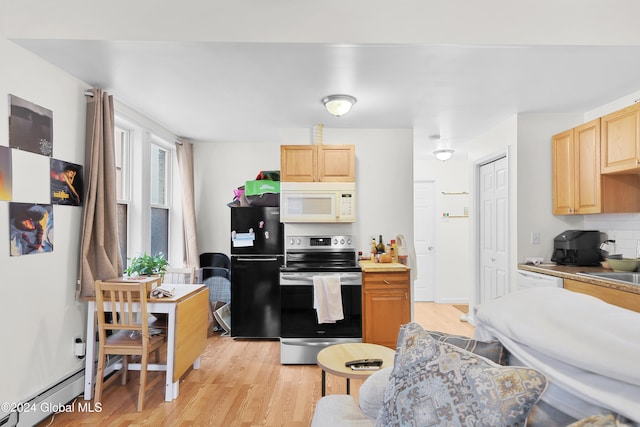 kitchen with light brown cabinets, black fridge, stainless steel electric range oven, and light wood-type flooring