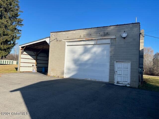 garage with a carport