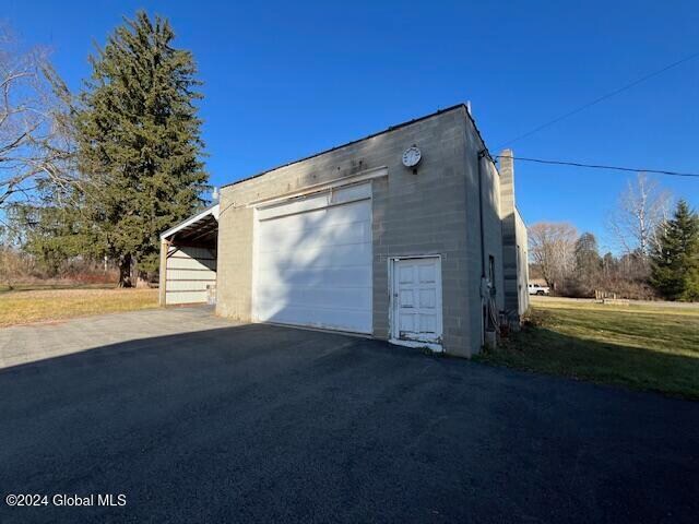 garage featuring a carport