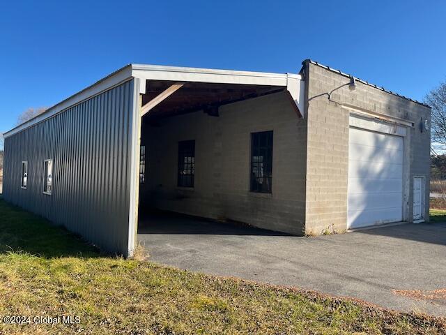 view of property exterior with a carport