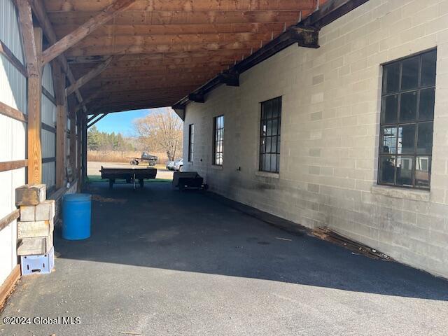 exterior space with a carport