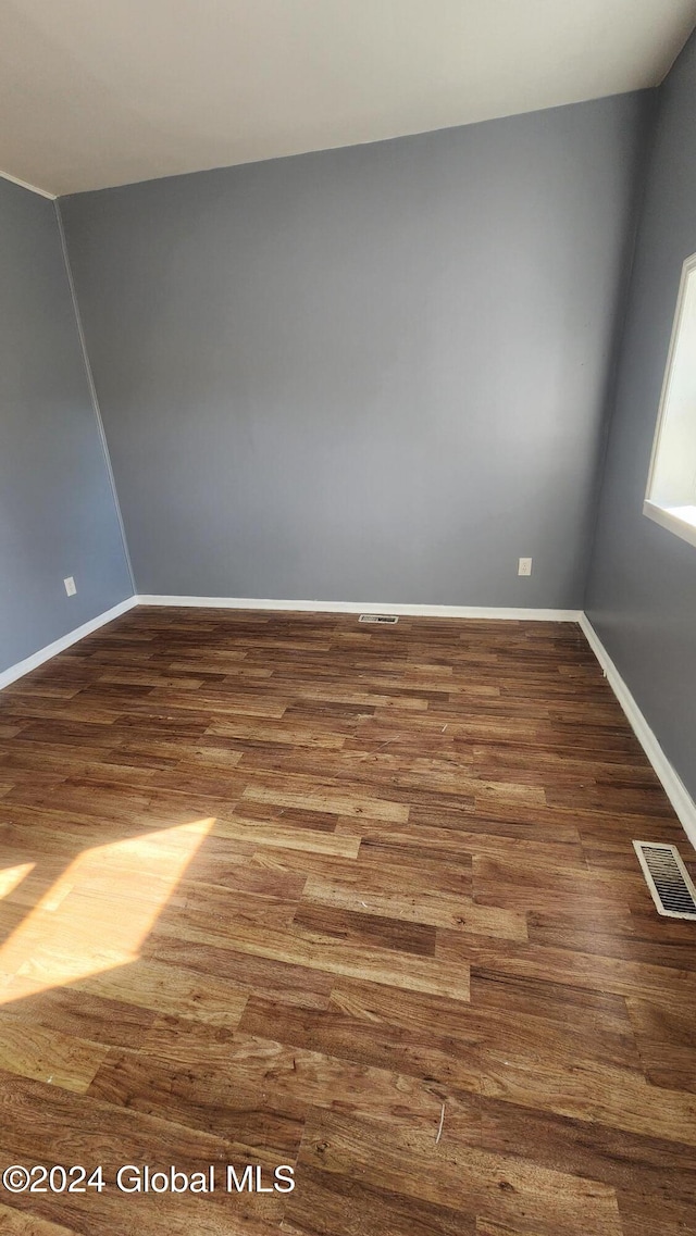 unfurnished room featuring hardwood / wood-style floors