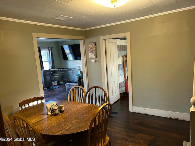 dining area featuring dark hardwood / wood-style flooring and ornamental molding