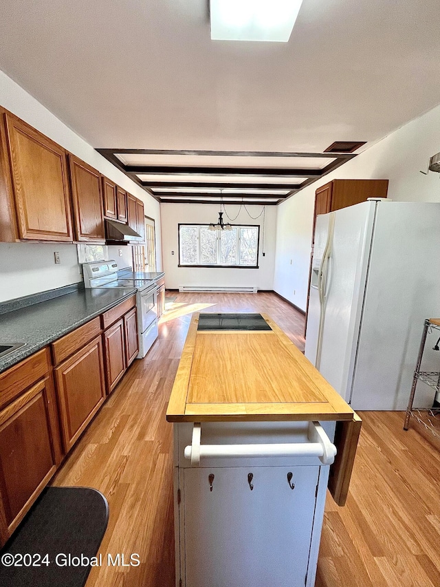 kitchen featuring white appliances, a baseboard heating unit, wooden counters, light wood-type flooring, and a kitchen island