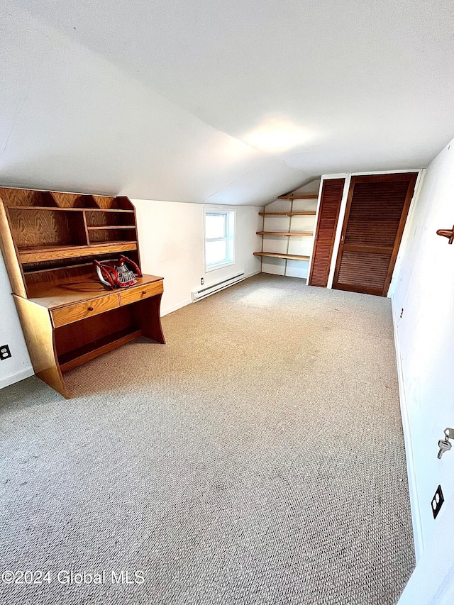 bonus room with carpet flooring, lofted ceiling, and a baseboard heating unit