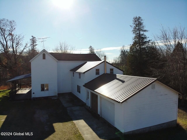 view of side of property with a garage