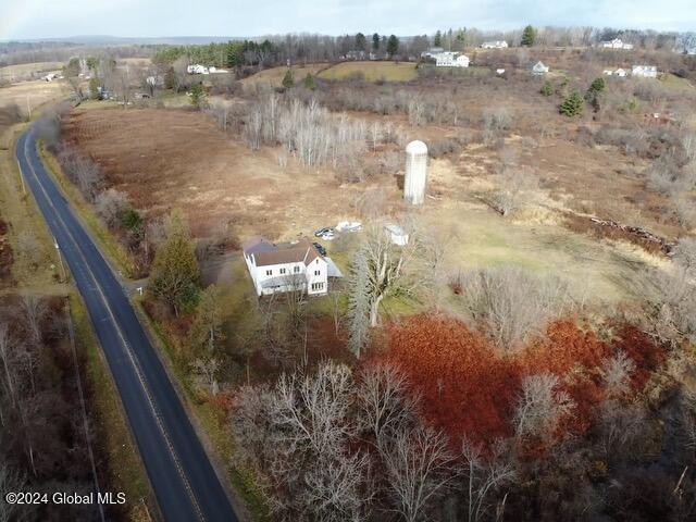 birds eye view of property with a rural view