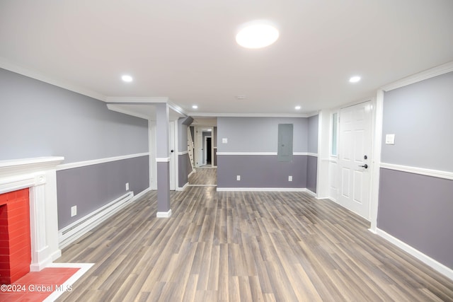 basement with electric panel, crown molding, dark wood-type flooring, and a brick fireplace