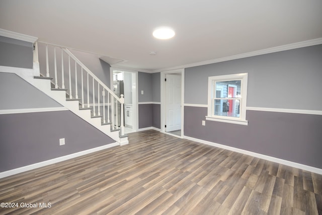 interior space with wood-type flooring and crown molding