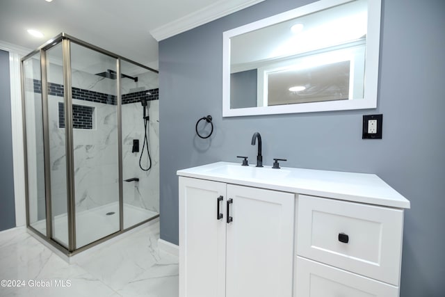 bathroom with vanity, an enclosed shower, and ornamental molding