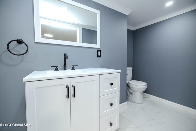 bathroom featuring crown molding, vanity, and toilet