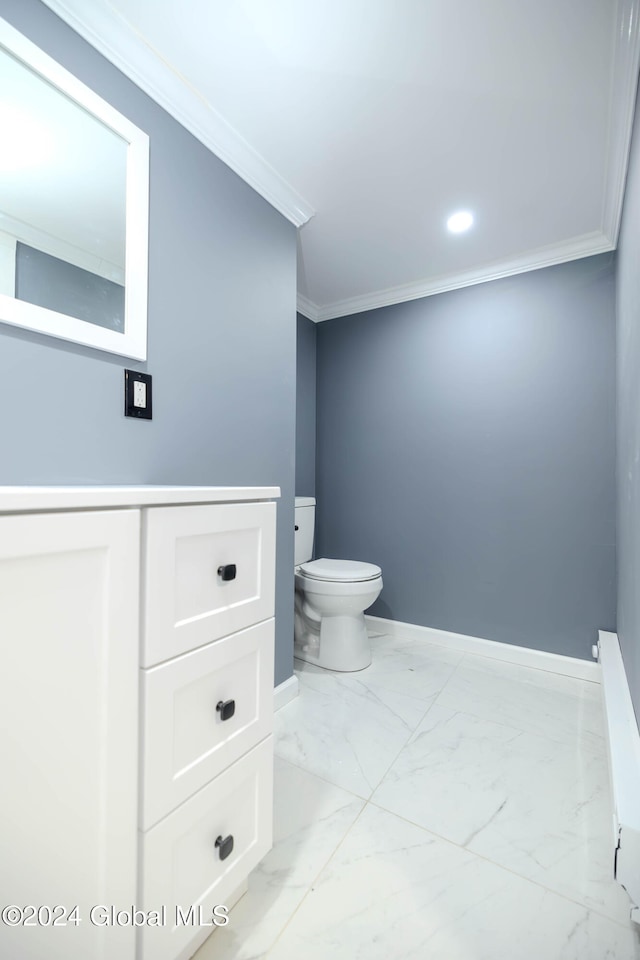 bathroom with toilet and crown molding