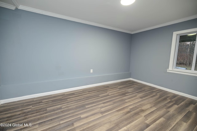 unfurnished room featuring dark hardwood / wood-style flooring and crown molding