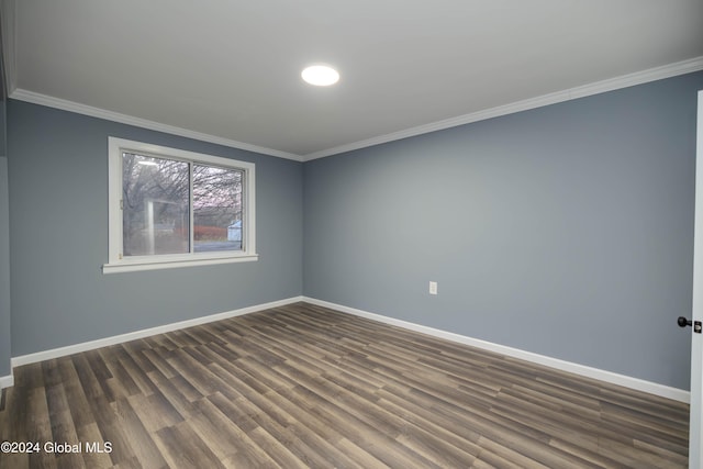 unfurnished room featuring dark hardwood / wood-style floors and ornamental molding