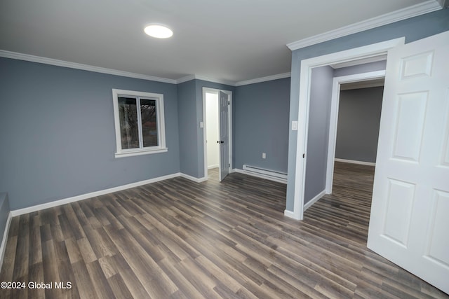 spare room featuring a baseboard radiator, dark hardwood / wood-style floors, and ornamental molding