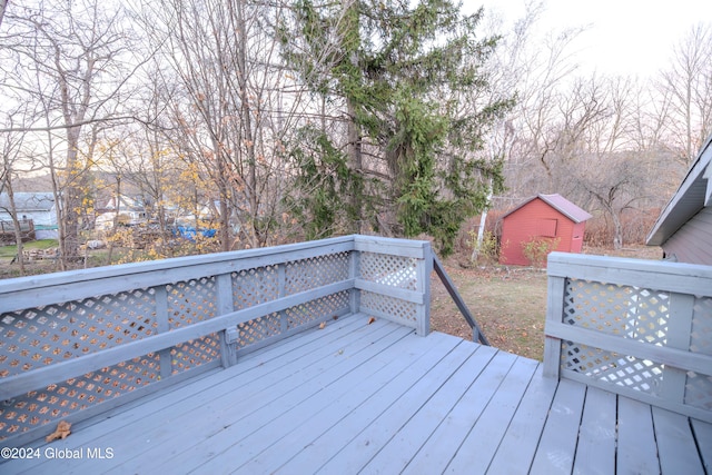 wooden deck with a storage shed