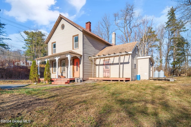 view of front of property with a porch and a front yard