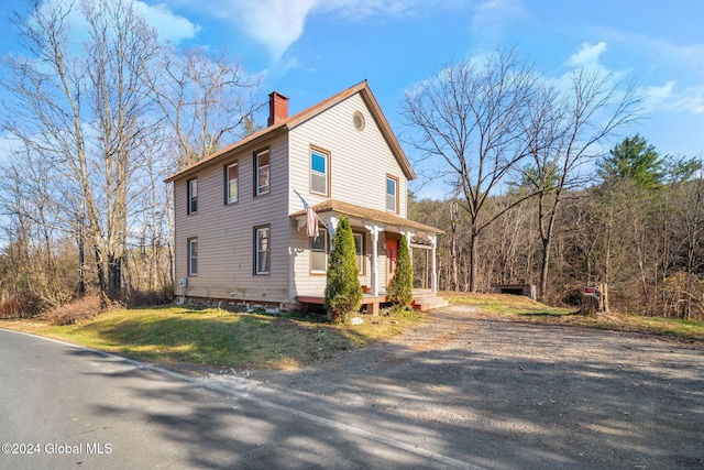 view of side of property with a porch