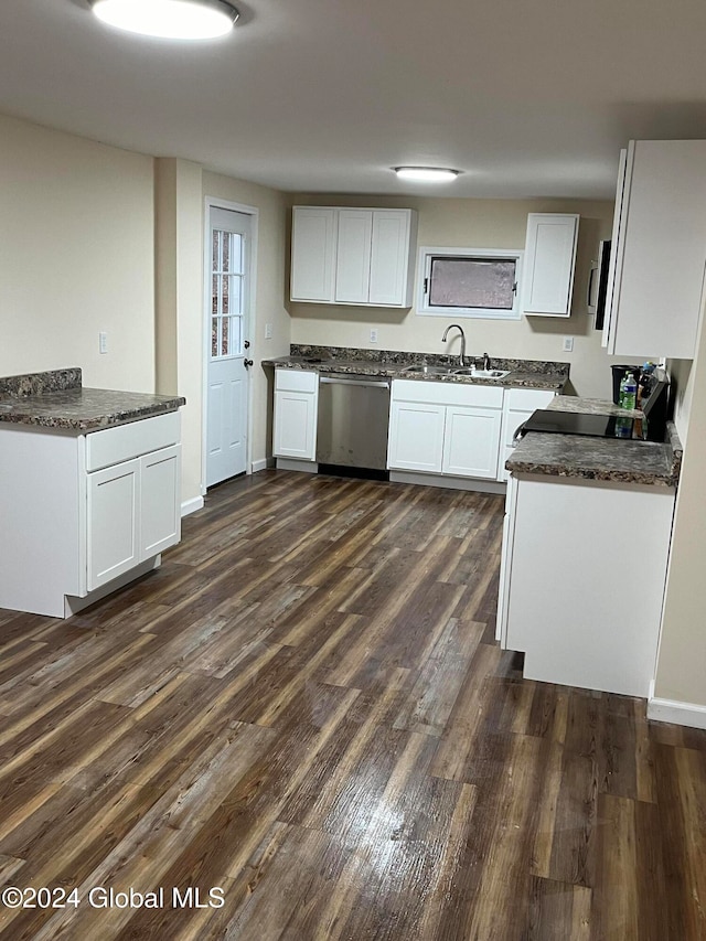 kitchen with white cabinets, dark hardwood / wood-style floors, sink, and appliances with stainless steel finishes