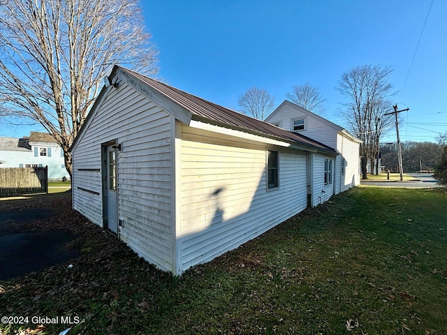 view of home's exterior featuring a lawn