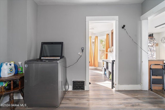 washroom with wood-type flooring