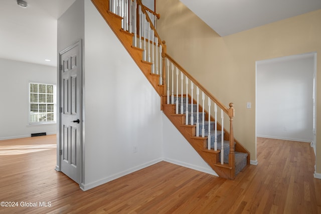 stairway featuring hardwood / wood-style flooring