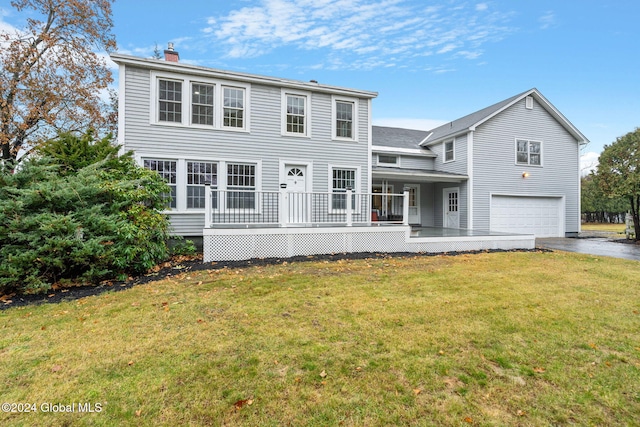 view of front facade featuring covered porch, a garage, and a front lawn