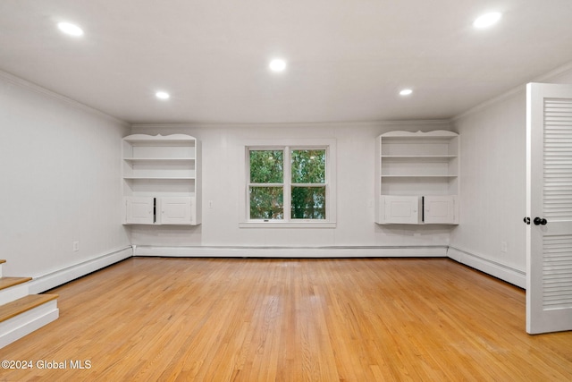 unfurnished living room featuring baseboard heating, crown molding, and light hardwood / wood-style flooring