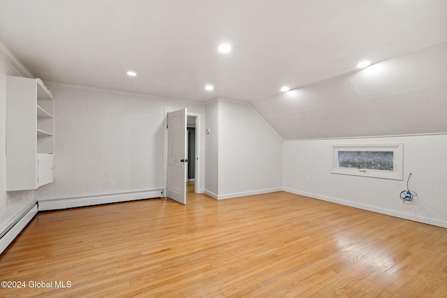 bonus room featuring lofted ceiling, light wood-type flooring, and baseboard heating