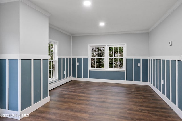 spare room with dark hardwood / wood-style flooring, ornamental molding, and baseboard heating