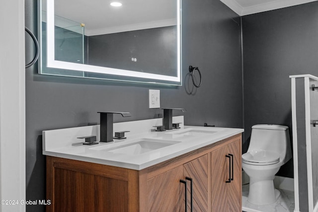 bathroom with vanity, toilet, and crown molding