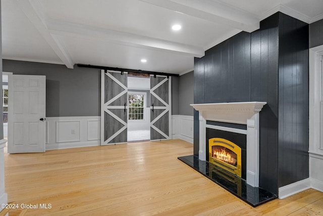 living room with hardwood / wood-style flooring, crown molding, and beamed ceiling