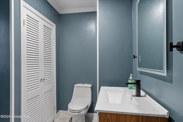 bathroom featuring vanity, toilet, and crown molding