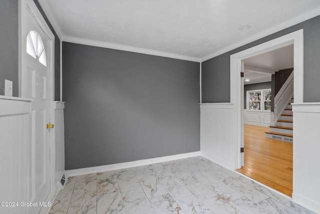 unfurnished room featuring light hardwood / wood-style floors and ornamental molding