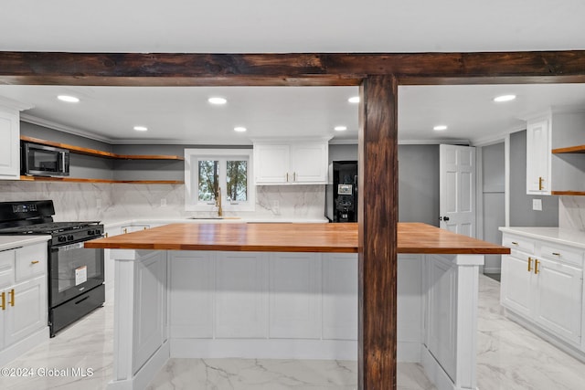 kitchen featuring black appliances, white cabinetry, and wooden counters