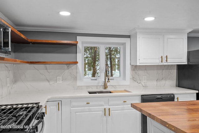 kitchen with decorative backsplash, ornamental molding, sink, white cabinetry, and stainless steel range with gas stovetop