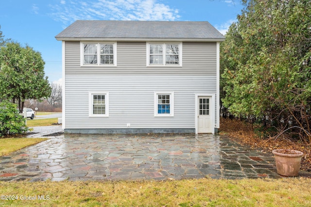 view of side of home featuring a patio