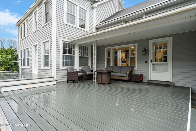 wooden deck with outdoor lounge area