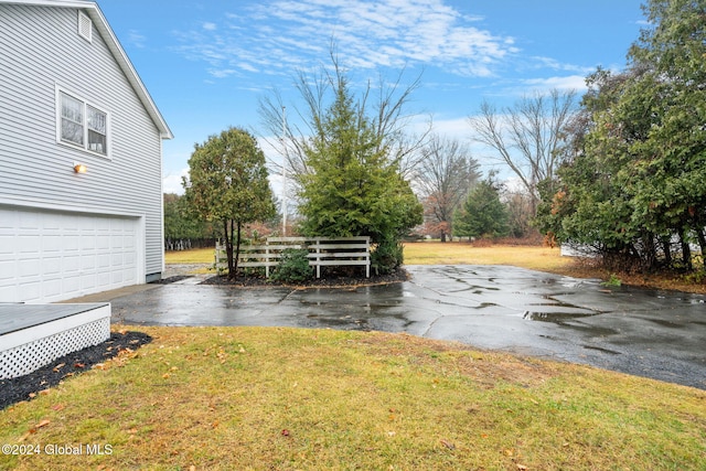 view of yard with a garage